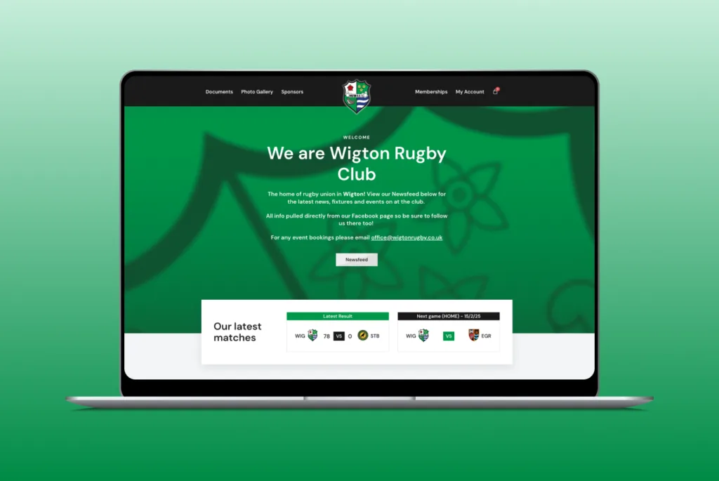 Wigton rugby club homepage on a laptop with green background